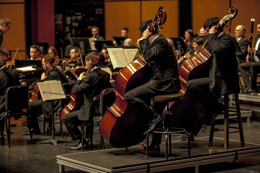 An orchestra performing during a classical concert