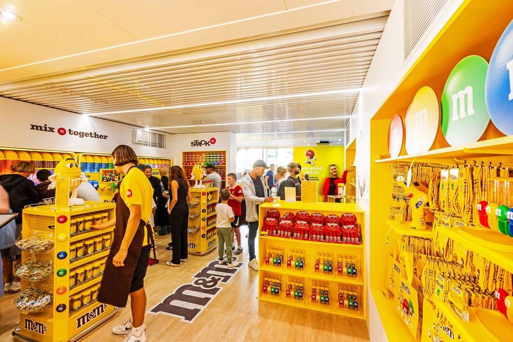 people shopping inside M&Ms store