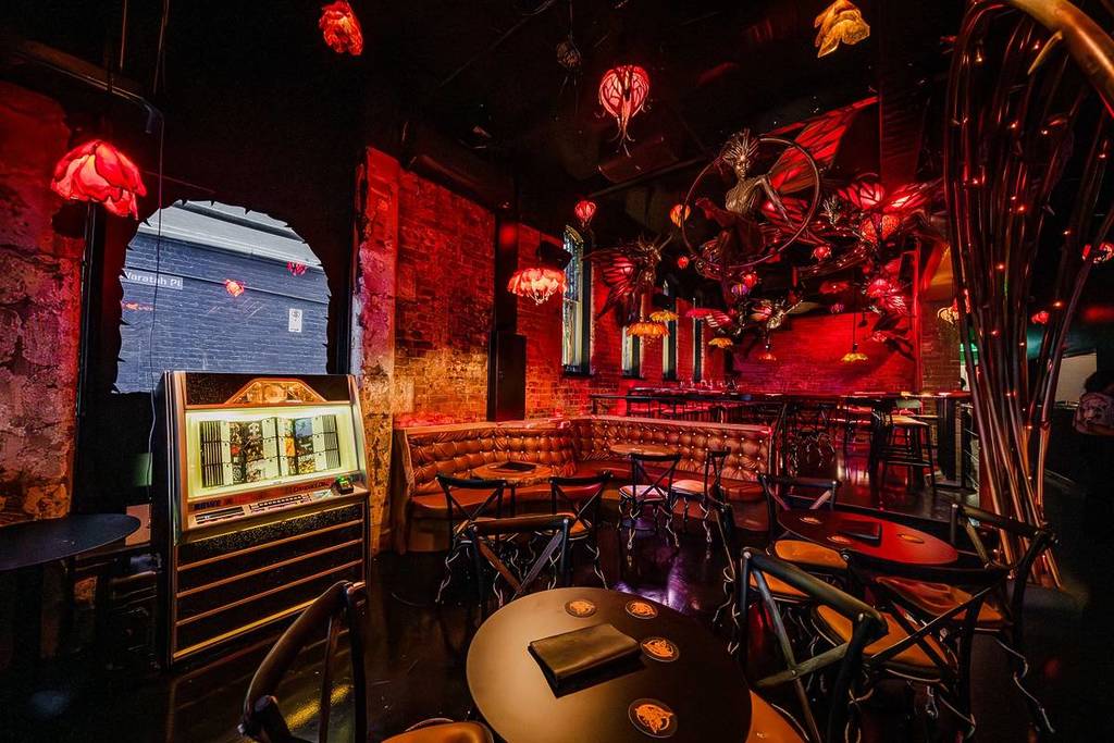 jukebox, booths and tables at Arcane Fairies