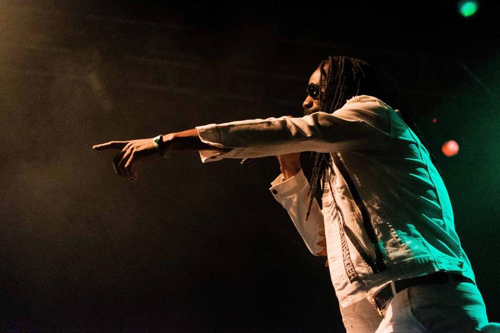 General Levy on stage pointing at audience