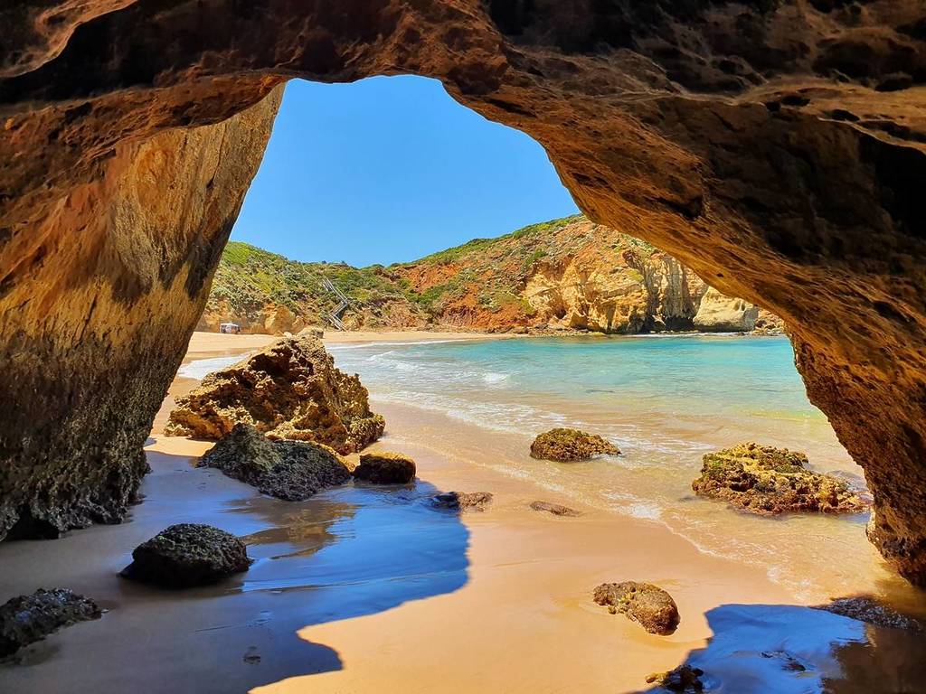 view of Childers Cove, seen from inside a cave at low tide