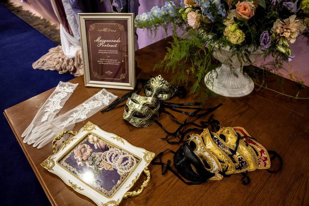 gloves, masks and jewellery on a table at the Bridgerton Masquerade Parlour