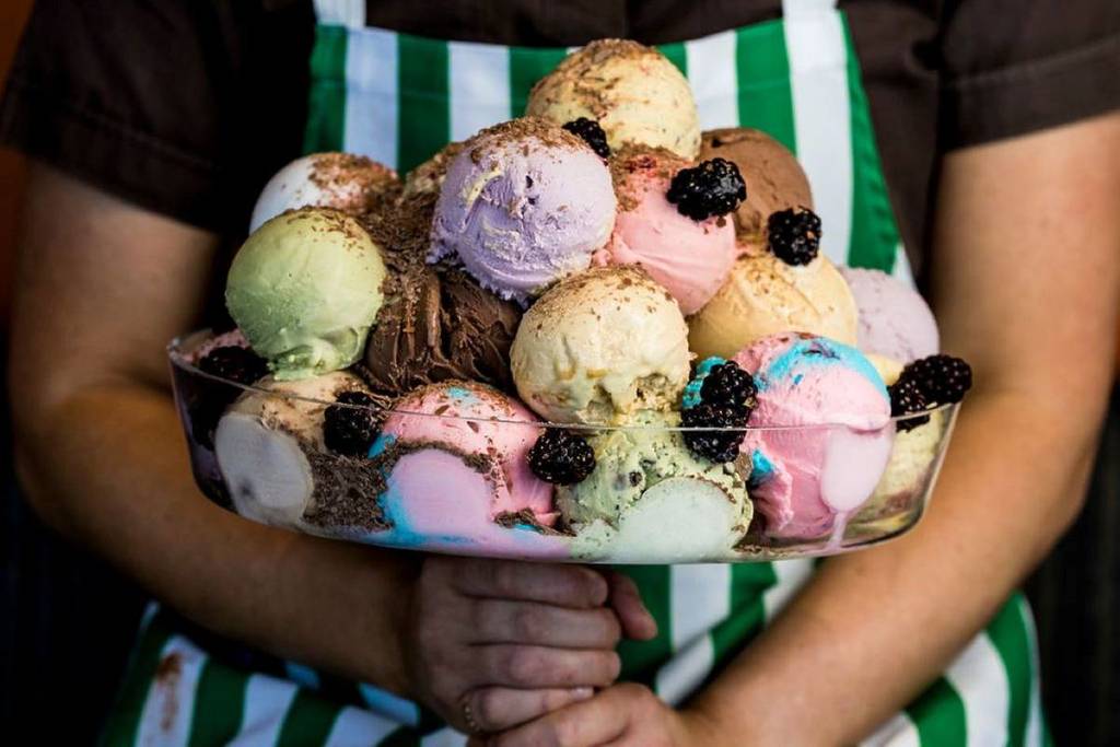 Giant bowl of ice cream scoops of different flavours
