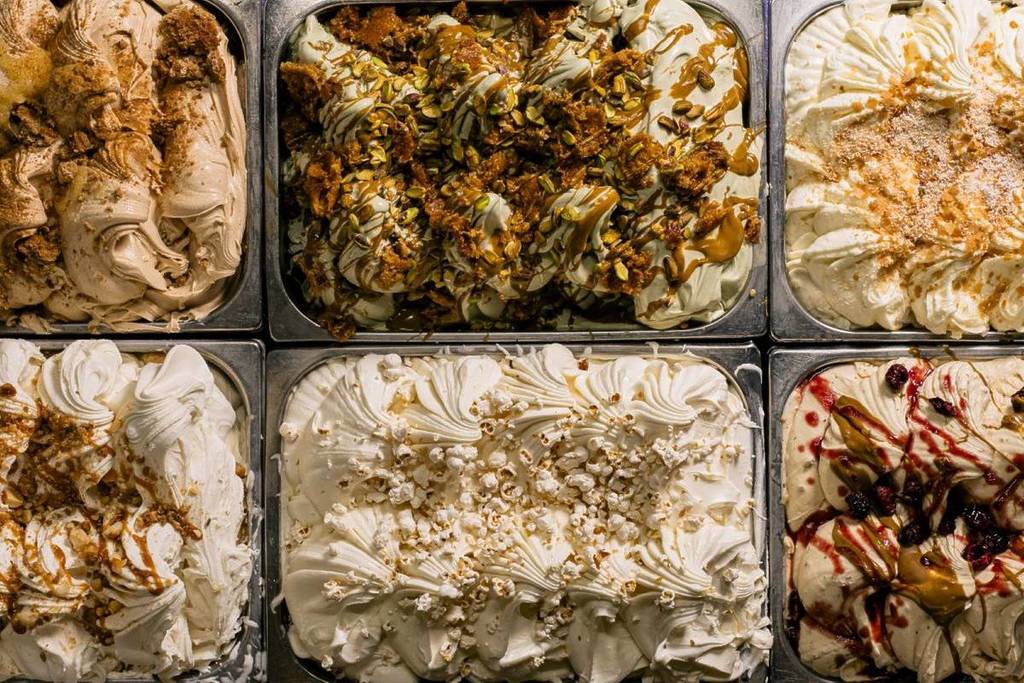 Trays of ice cream flavours laidout next to one another