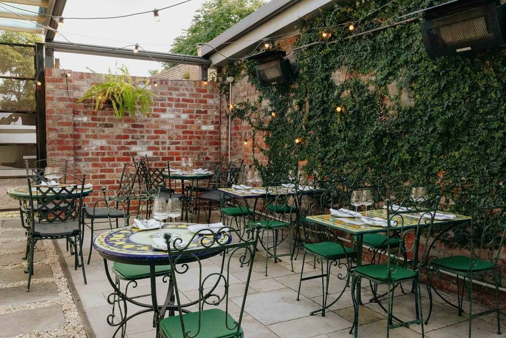 outdoor courtyard area of Officina Gastronomica Italiana