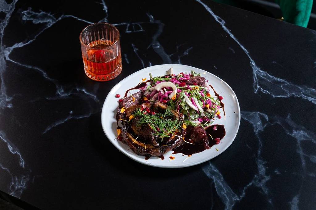 Pretty dishes laid out on black marble table at Lush 2.0