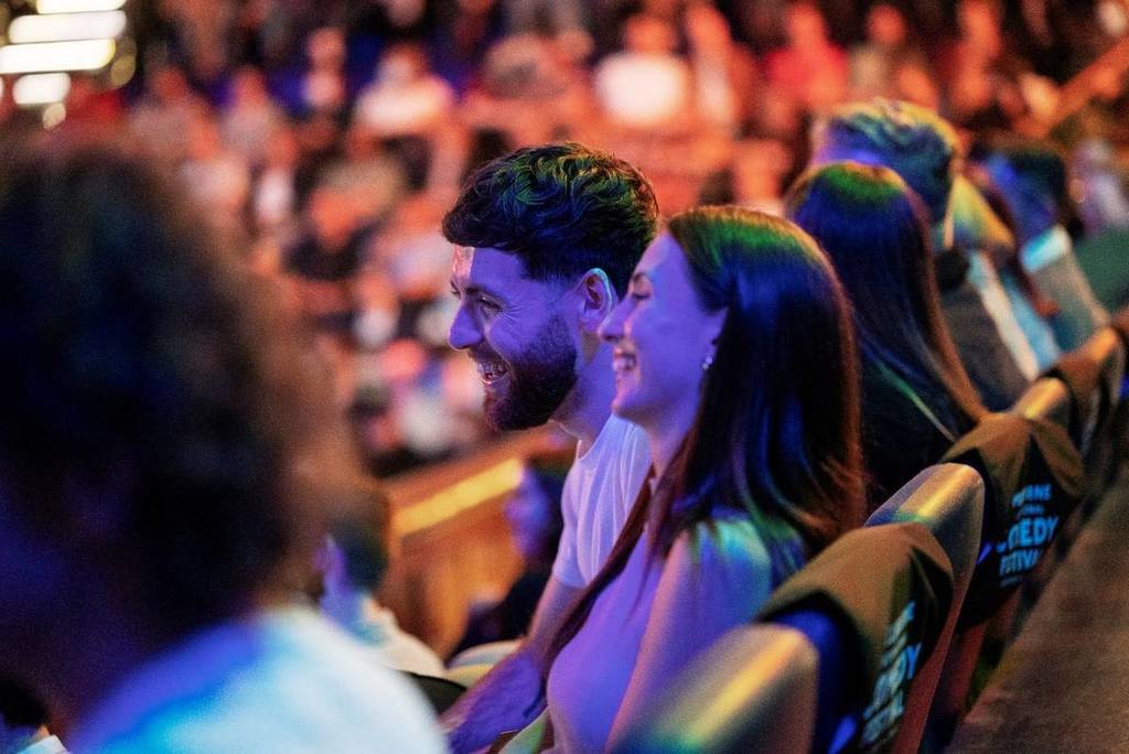 couple laughing during show at Melbourne International Comedy Festival