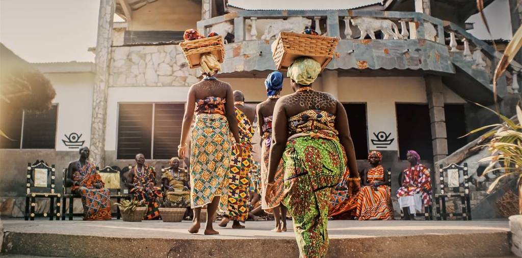 film still from The Fishermen, of women balancing baskets on their heads