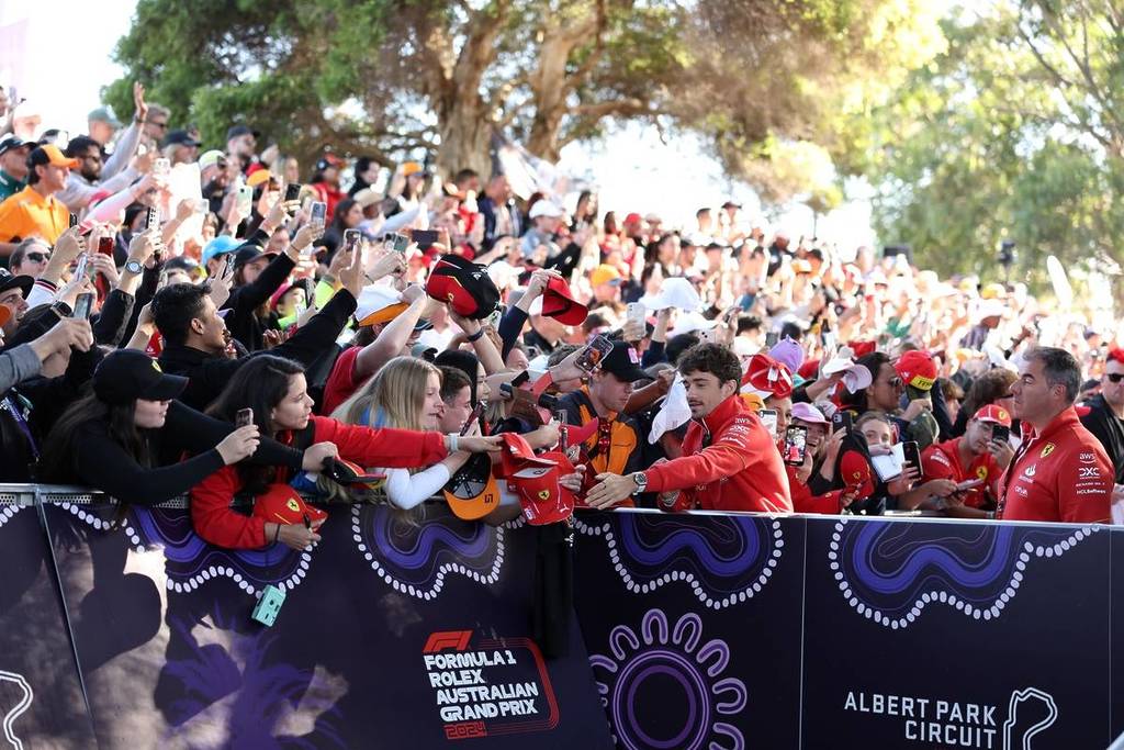 Charles Leclerc signing items for fans on the Melbourne Walk