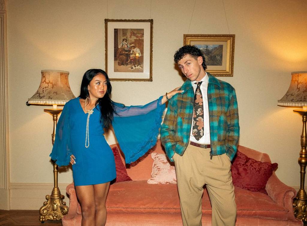 two models posing wearing clothes that could be at the National Trust's Vintage Clothing & Collectables Sale