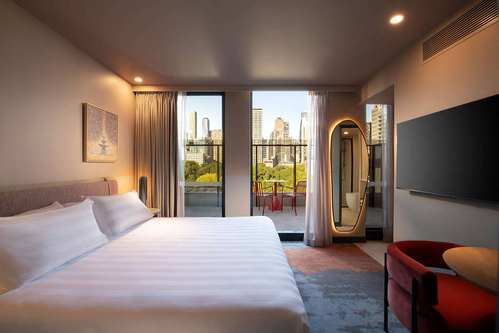 inside a superior king room with a view of the city at Mercure Melbourne La Trobe Street