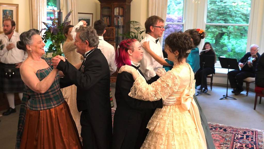 people in historic costumes dancing at the Duneira Estate Victorian Ball