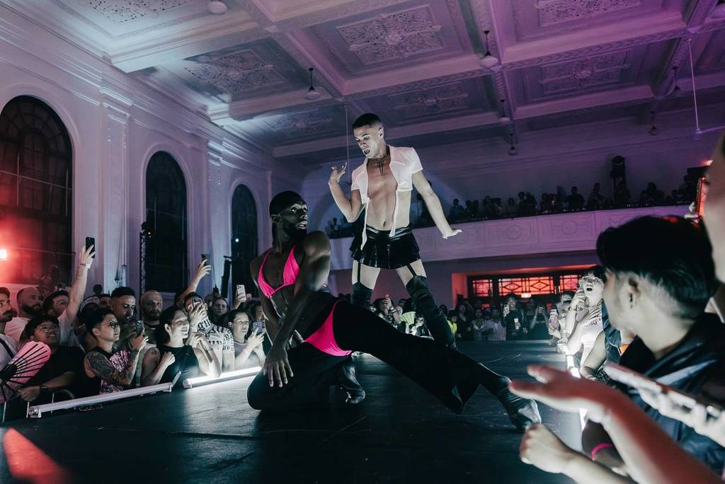 performers at Sissy Ball on a runway stage in front of a crowd