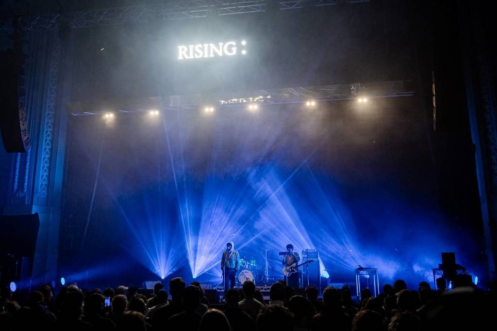 live music performance in front of big crowd at RISING festival