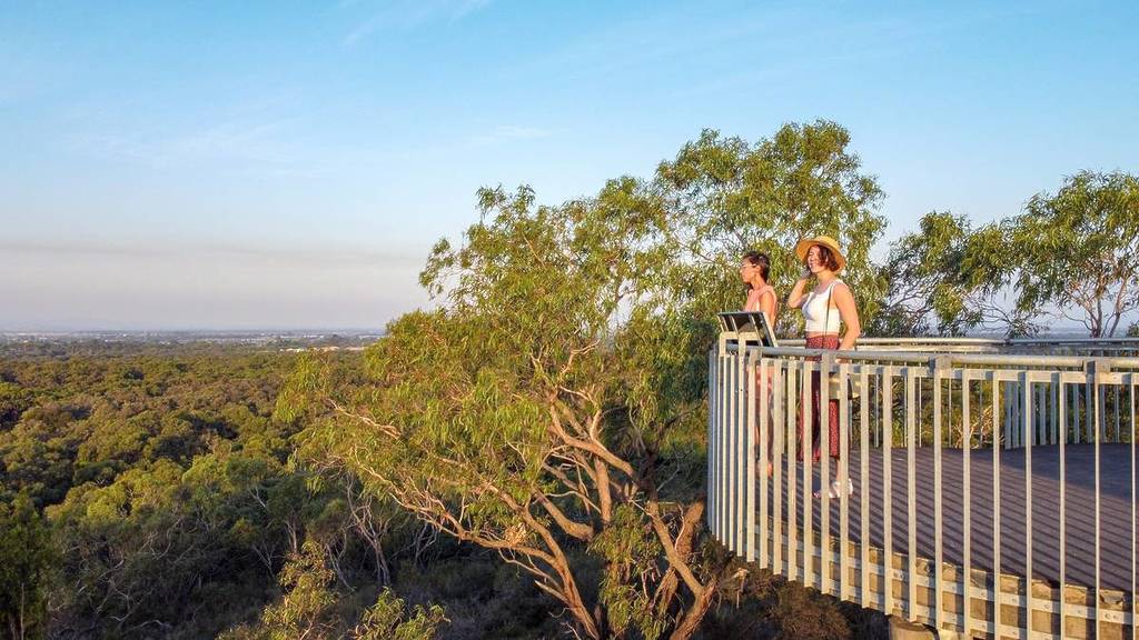 two woman at a view point looking out at the bushland around the Royal Botanic Gardens Cranbourne