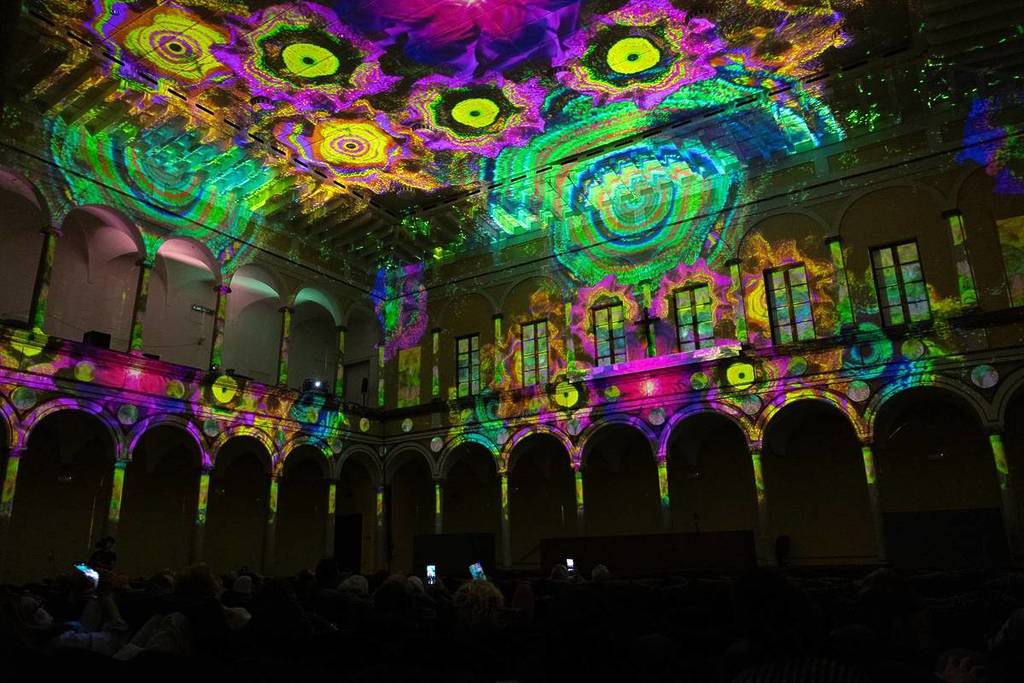 A vibrant display of patterns swirling along the walls of Eonarium: Enlightenment's venue