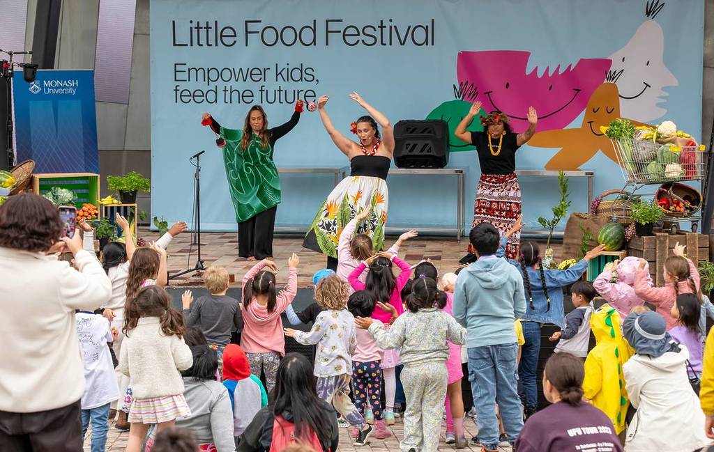 children looking at performers in Fed Square during the Little Food Festival