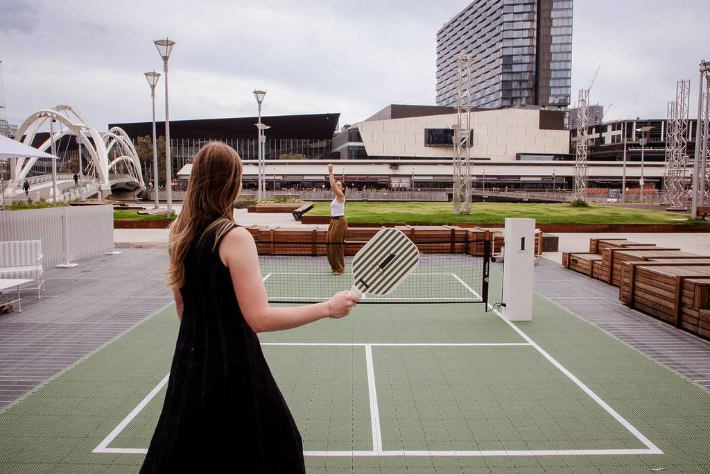 two people playing pickleball on the pop-up court at 1Hotel Melbourne
