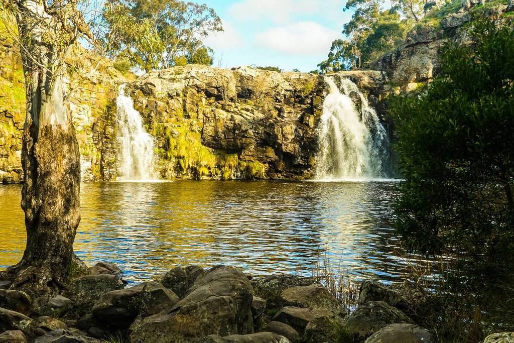 view of Turpins Falls from the base, photo taken behind some boulders