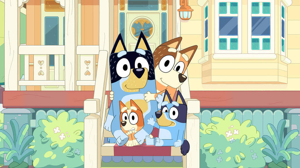 The Heeler family on the steps in front of their house