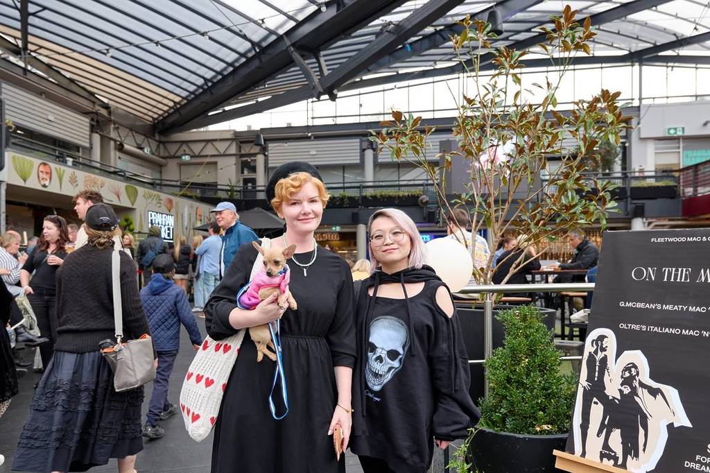two women at Prahran Market, one of them is holding a chihuahua