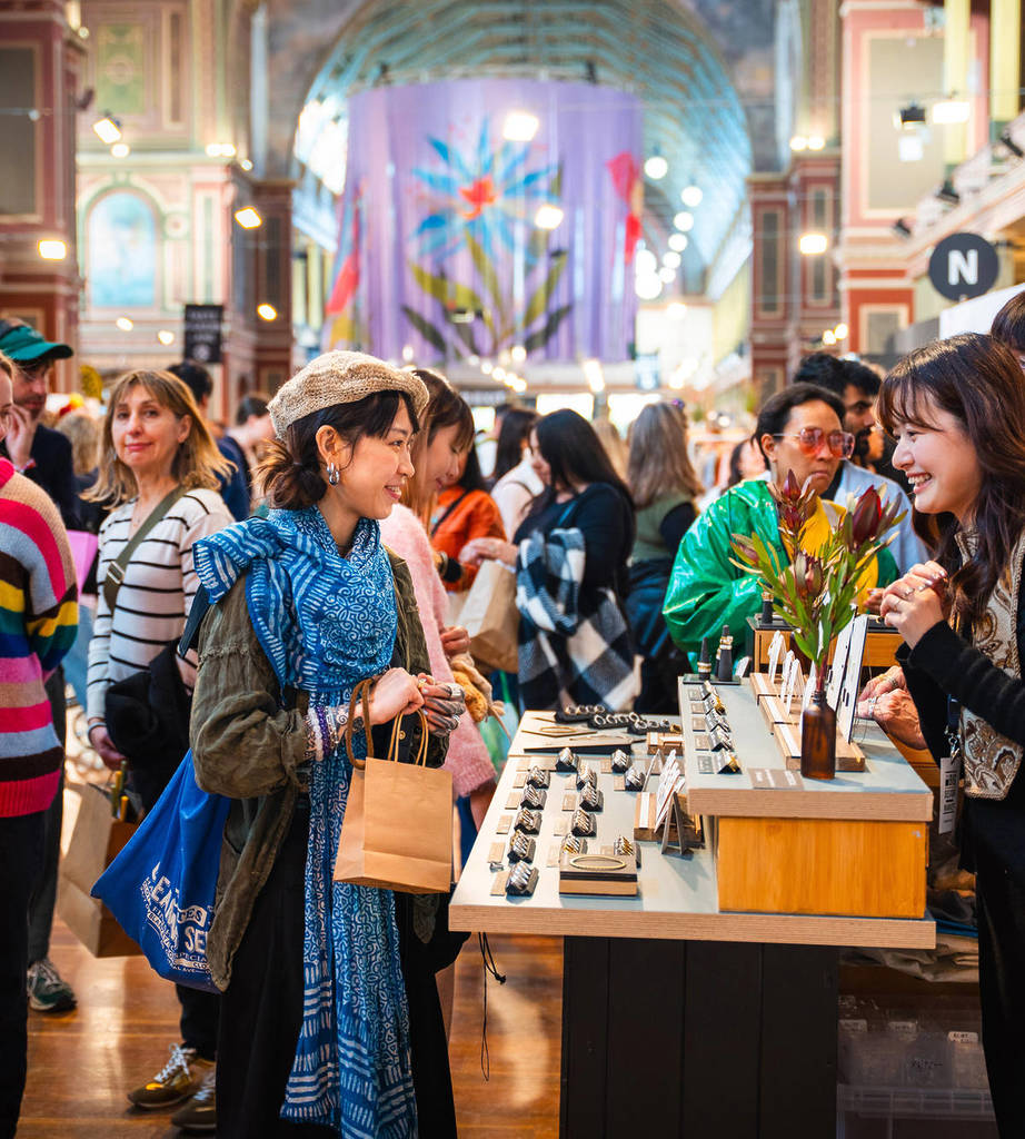 woman stopping at a stall at the Big Design Market