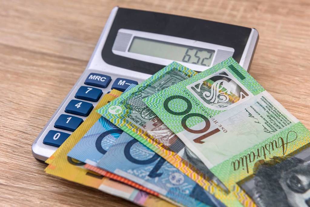 pile of Australian cash on top of a calculator