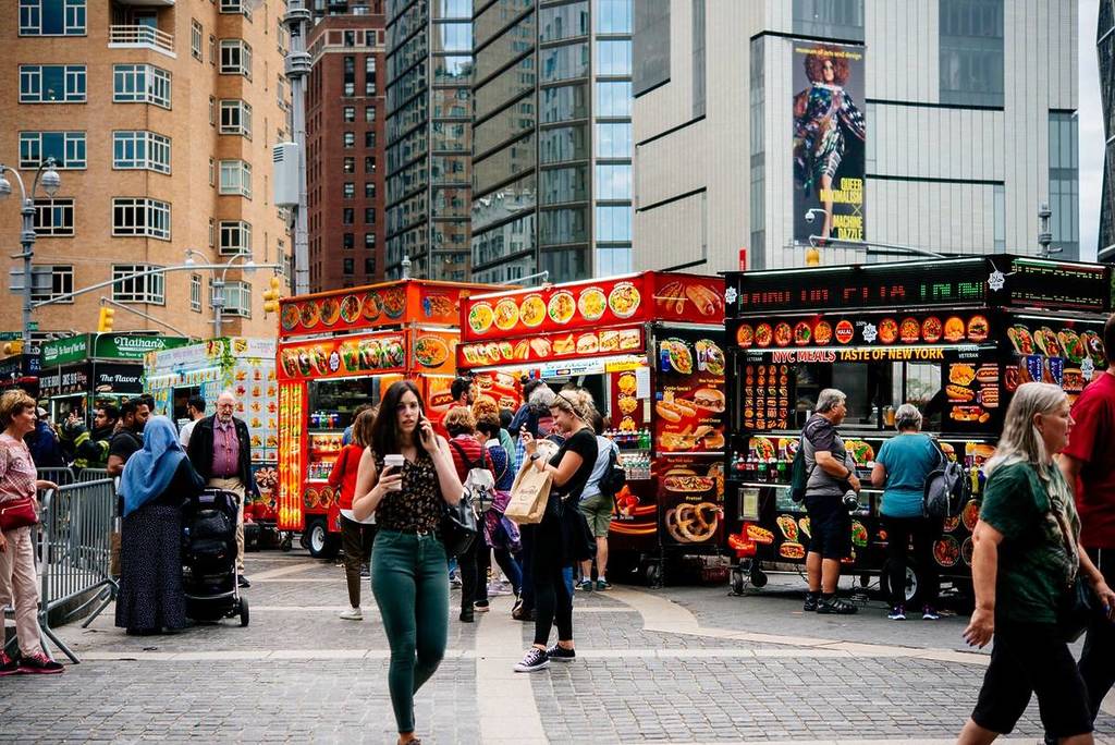 people eating food in NYC