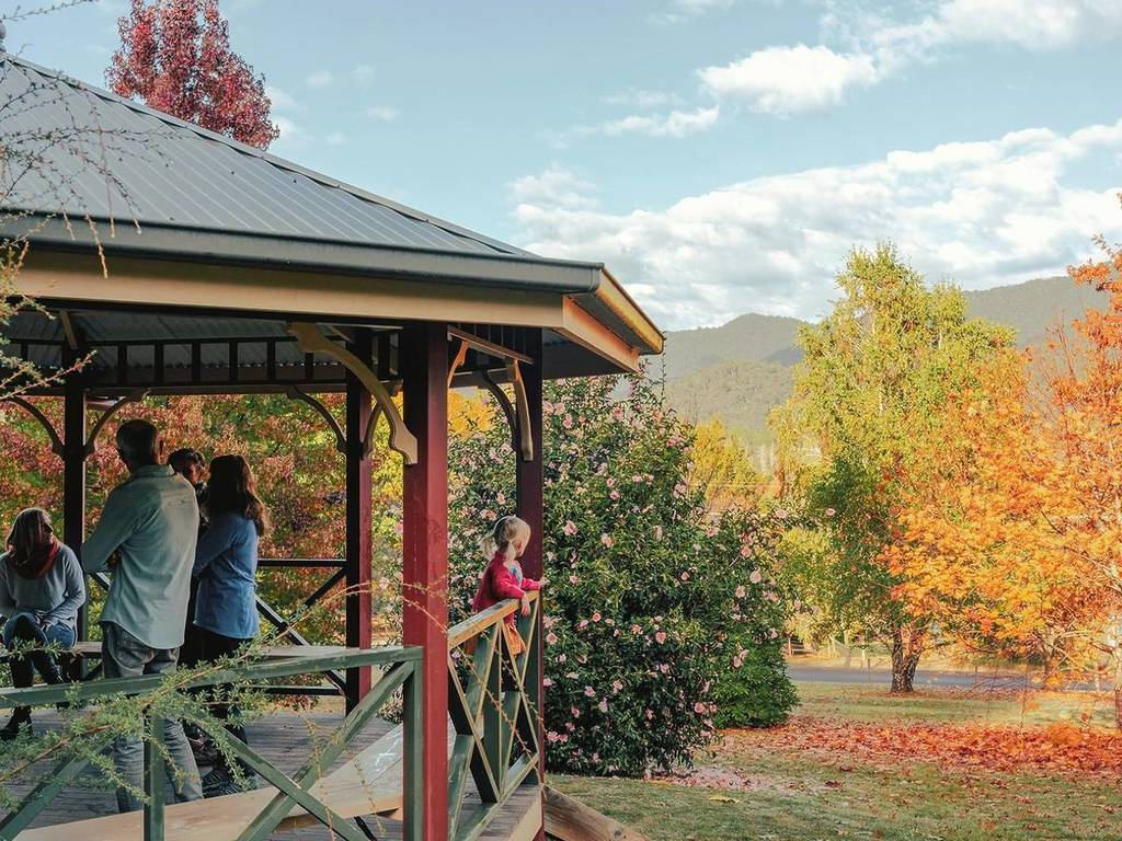 family under a pavilion at the arboretum in Jamieson during autumn