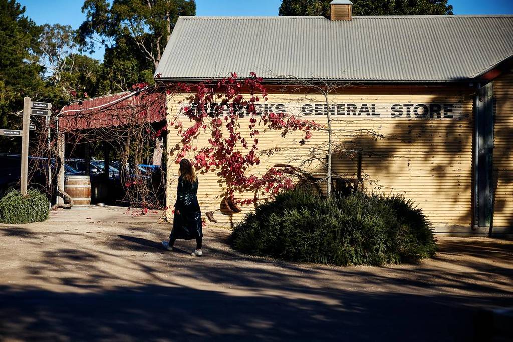 woman walking outside Merricks General Store