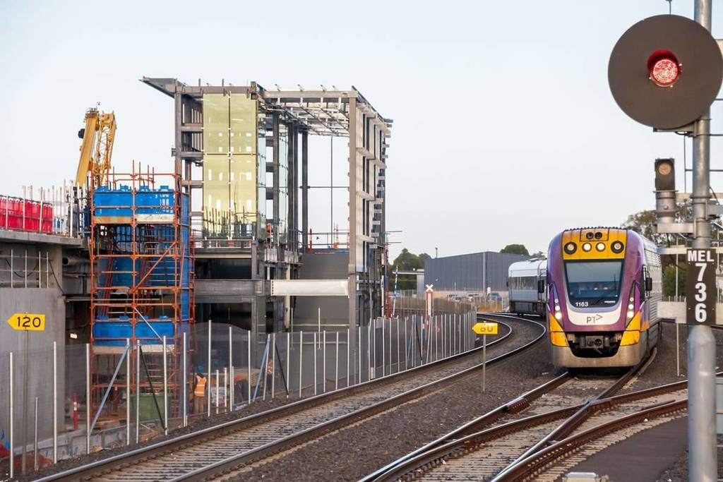 a V/Line train on the track next to Melton Station, which is currently under construction