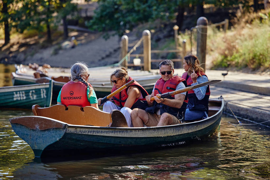 a family in a row boat from Fairfield Park Boathouse