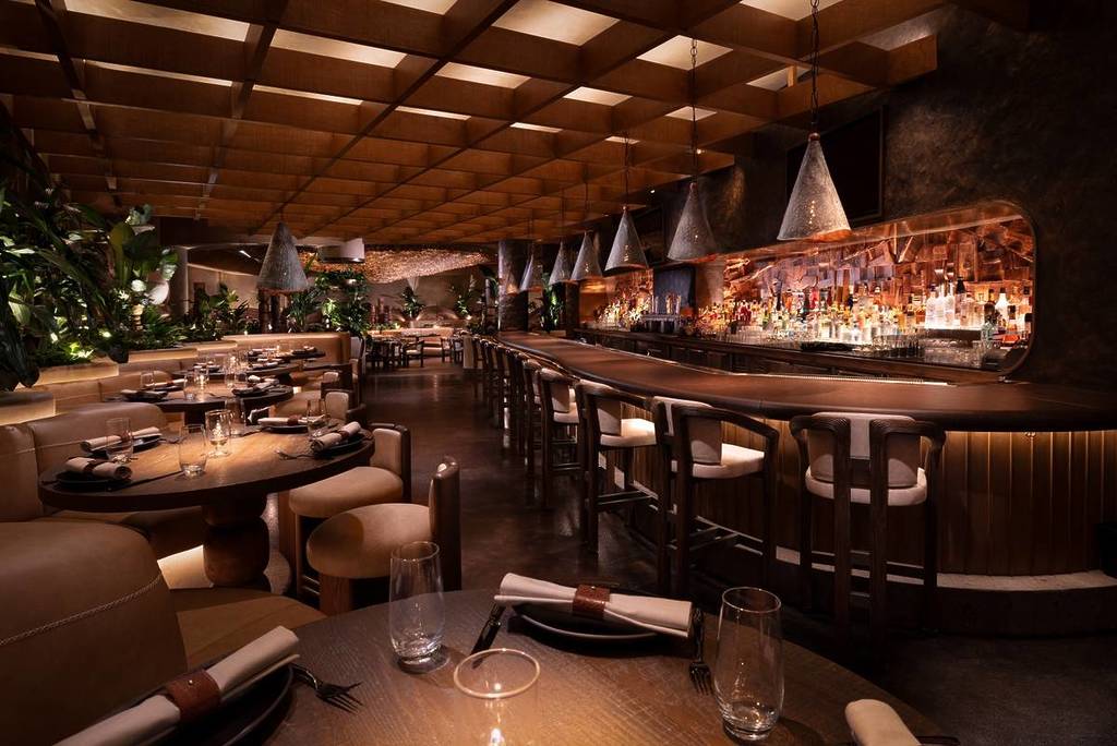 interiors of Amaya Modern Mexican restaurant, with dining tables and a bar area