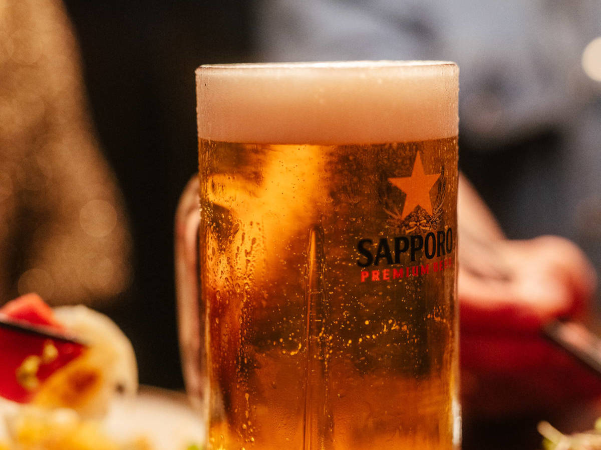 mug of sapporo beer on table