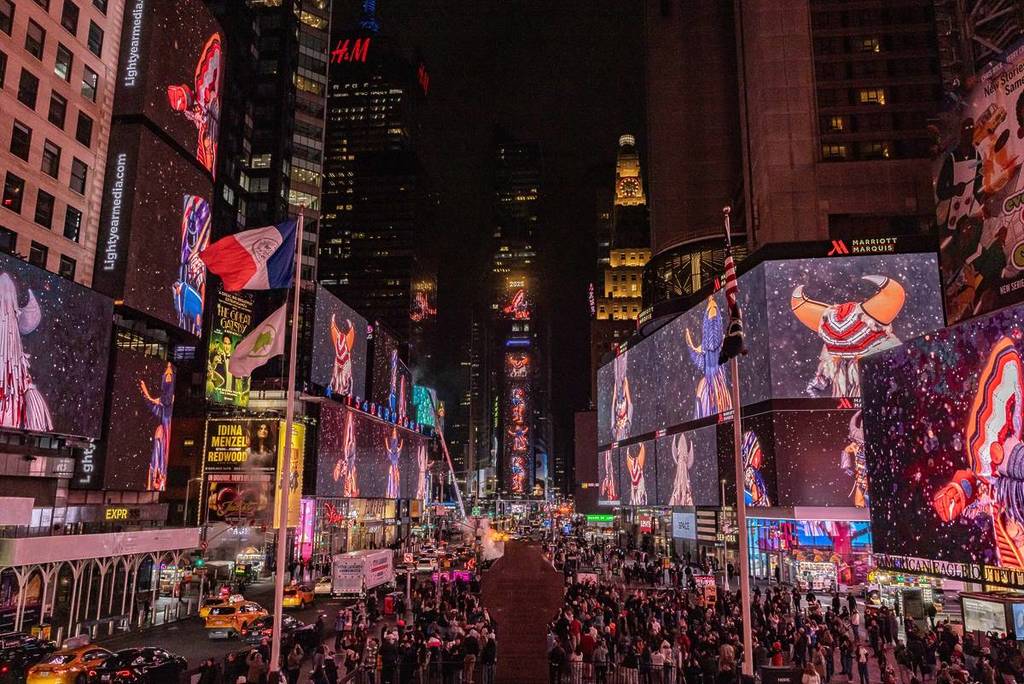 artwork by Cannupa Hanska Lager on all the screens in busy Times Square New York