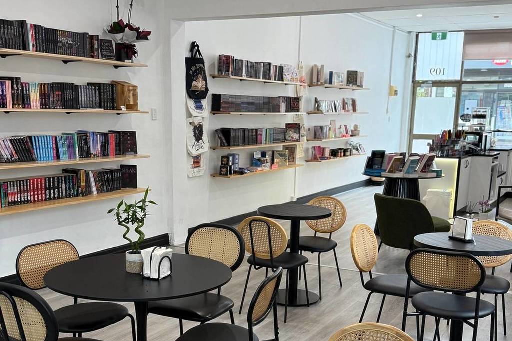 inside Trilogy of Romance book cafe, with seats and shelves on the wall filled with books