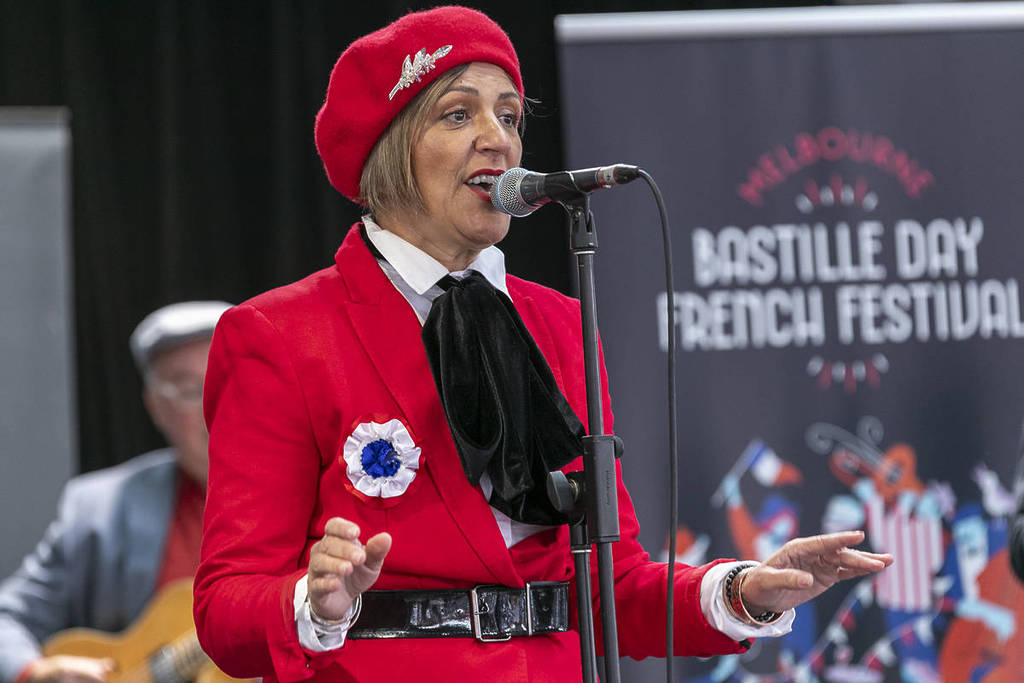 singer performing at Bastille Day French Festival