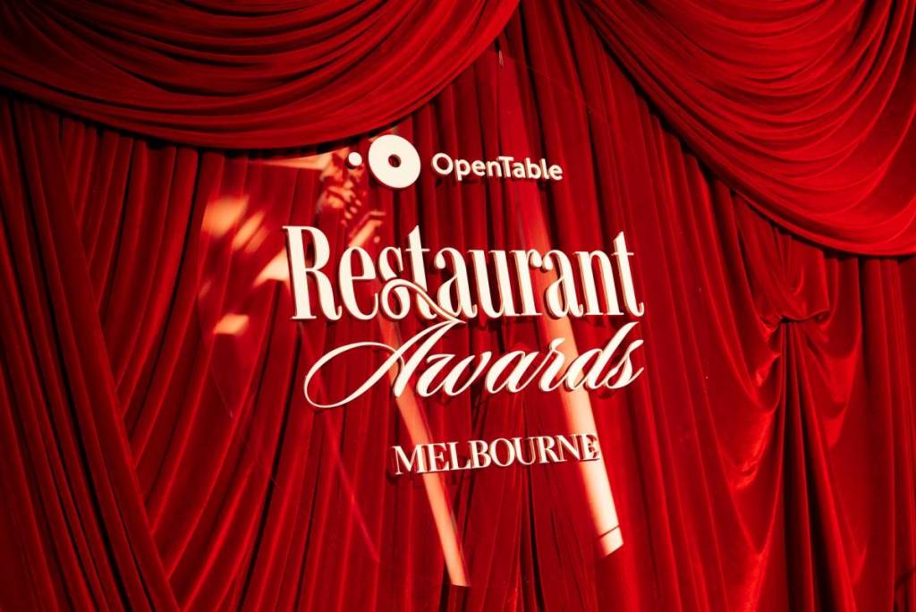 the red curtain at the Opentable Restaurant Awards in Melbourne, with a sign stating the event