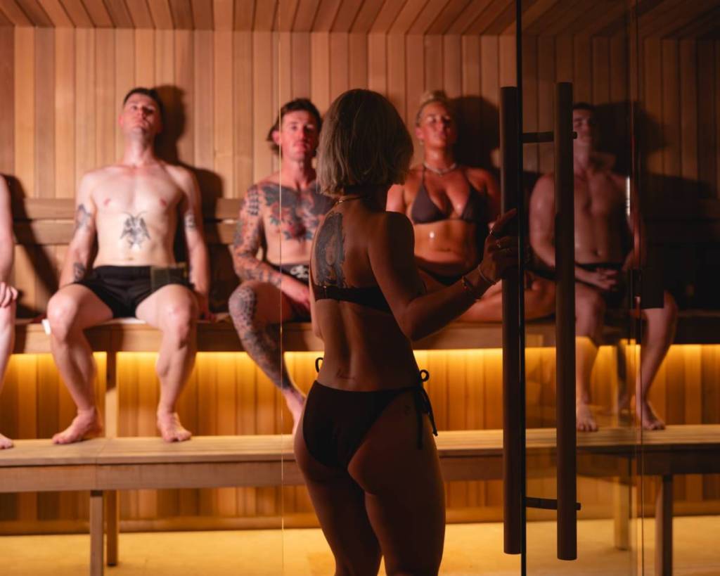 woman entering the sauna at Wellness Social Club