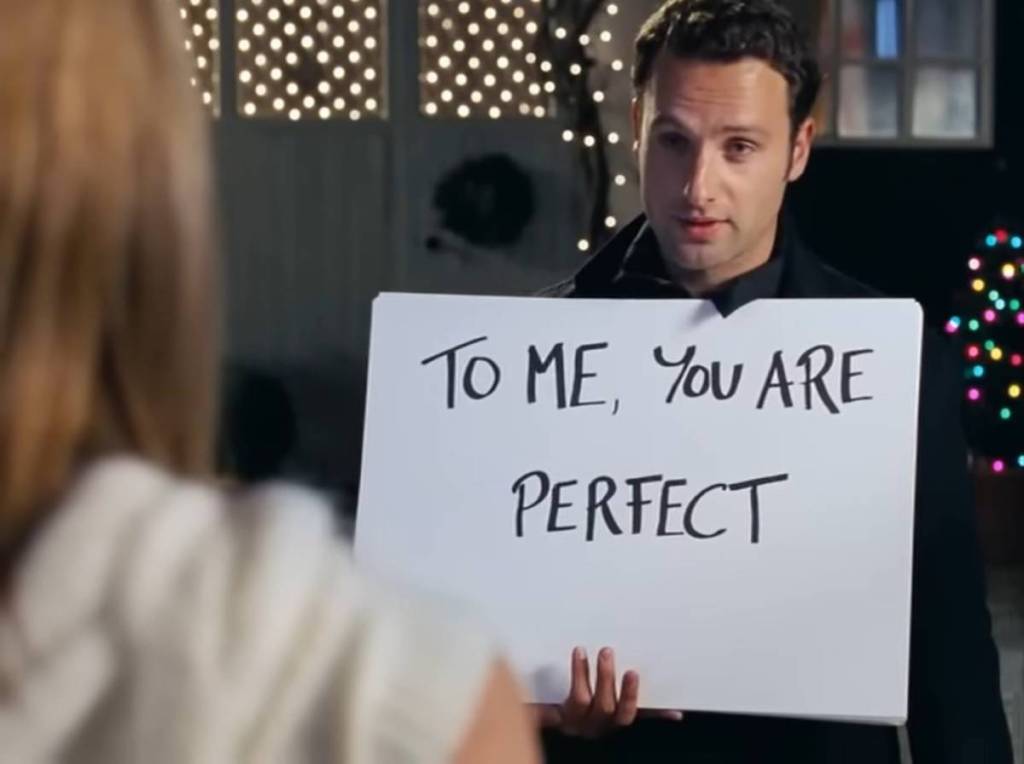 scene from Love Actually where Andrew Lincoln's character holds up a sign that says 'To Me, You Are Perfect' to Kiera Knightley's character