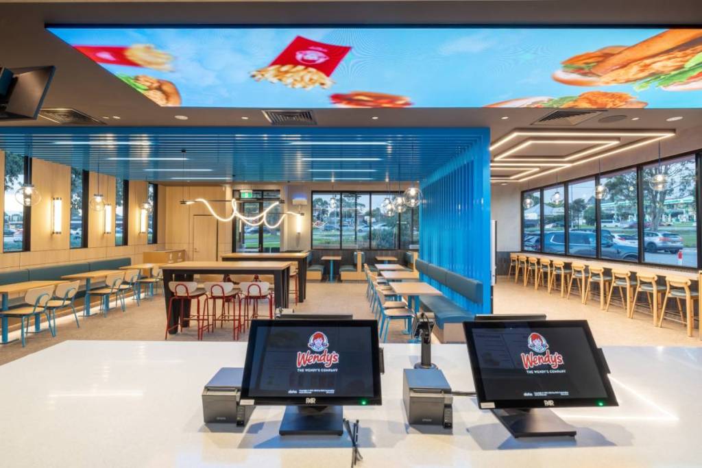 inside the Wendy's restaurant in Dandenong South, showing seats, tables and ordering counters