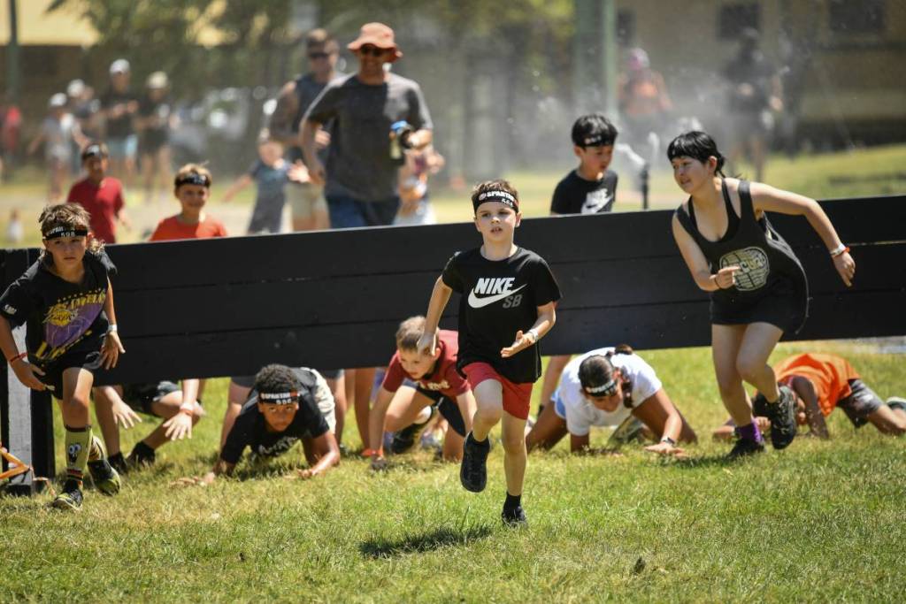 kids running in a spartan race