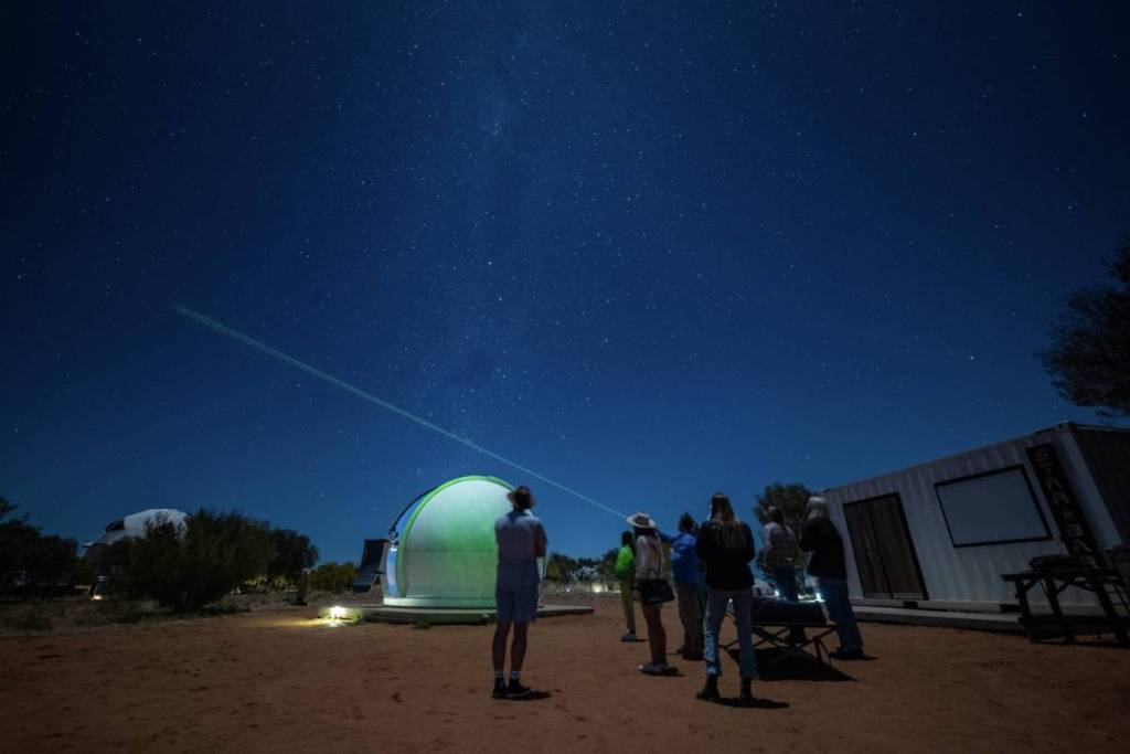 people at Earth Sanctuary in Alice Springs at night