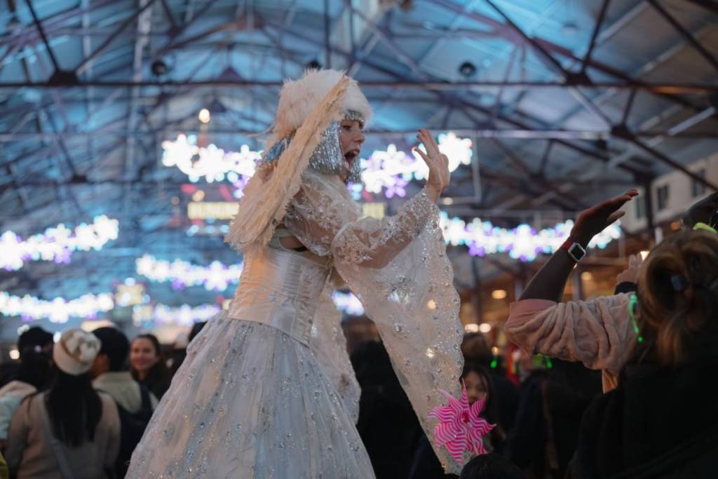 angel entertainer at Winter Night Market for Christmas in July