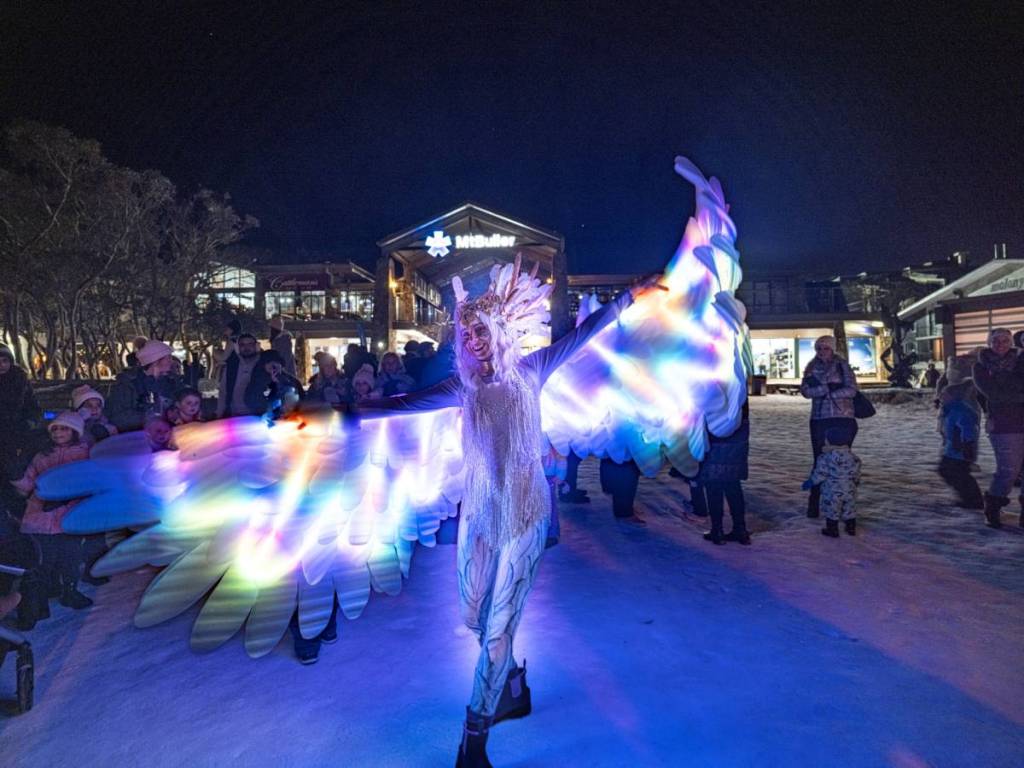 roving performer with LED wings at Mt Buller