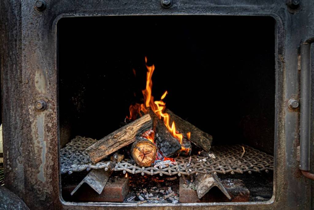 a wood fire in a smoker