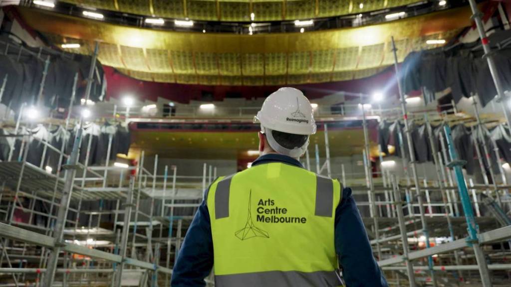 worker in high-vis looking at construction works for Truscott Ceiling in the Ian Potter State Theatre