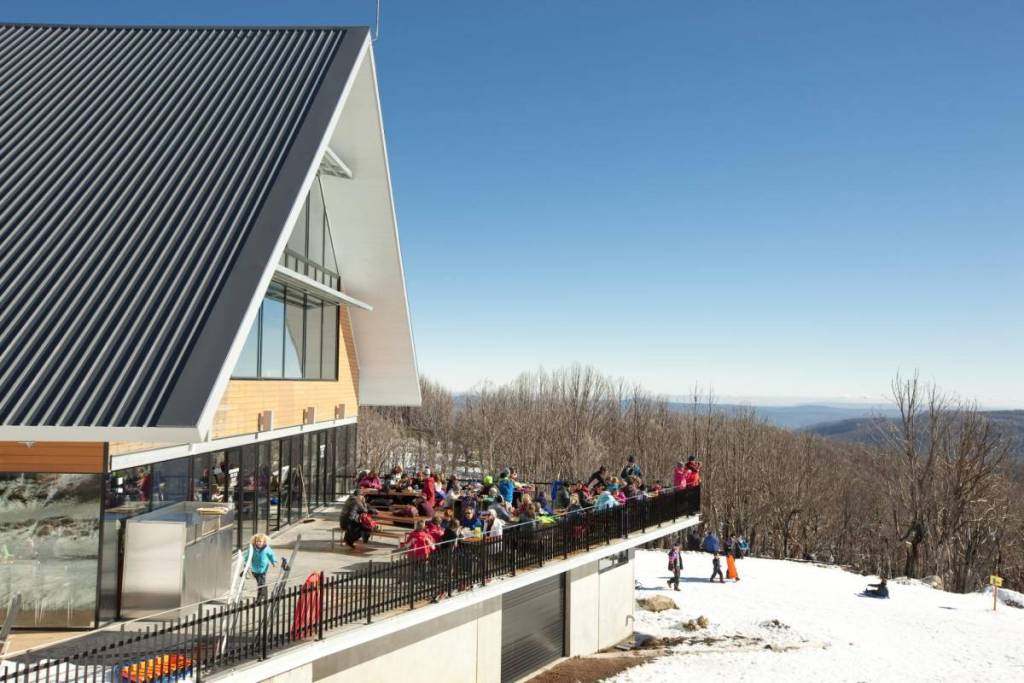 people eating on the bistro balcony at Lake Mountain