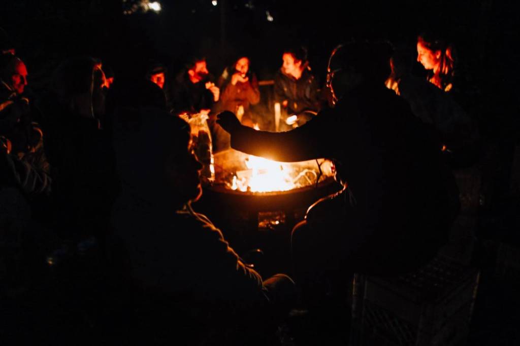 people gathered around a bonfire to depict what you might see at Nocturne Healesville After Dark