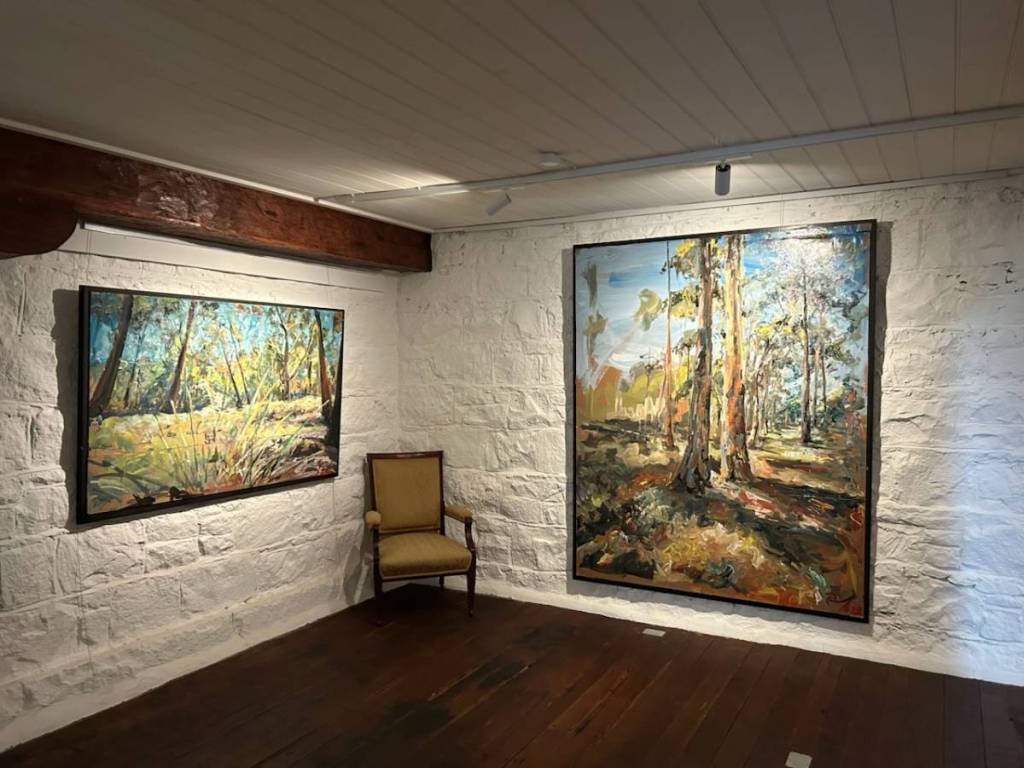 paintings on display in an exhibition at Campaspe Mill Distillery
